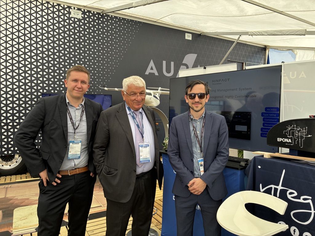 Three people on the booth shared with Aura Aero at the Paris Air Show 2025.