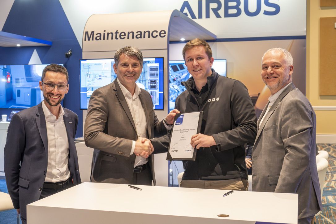 Hinfact and Airbus Training shake hands on their collaboration at WATS 2024.